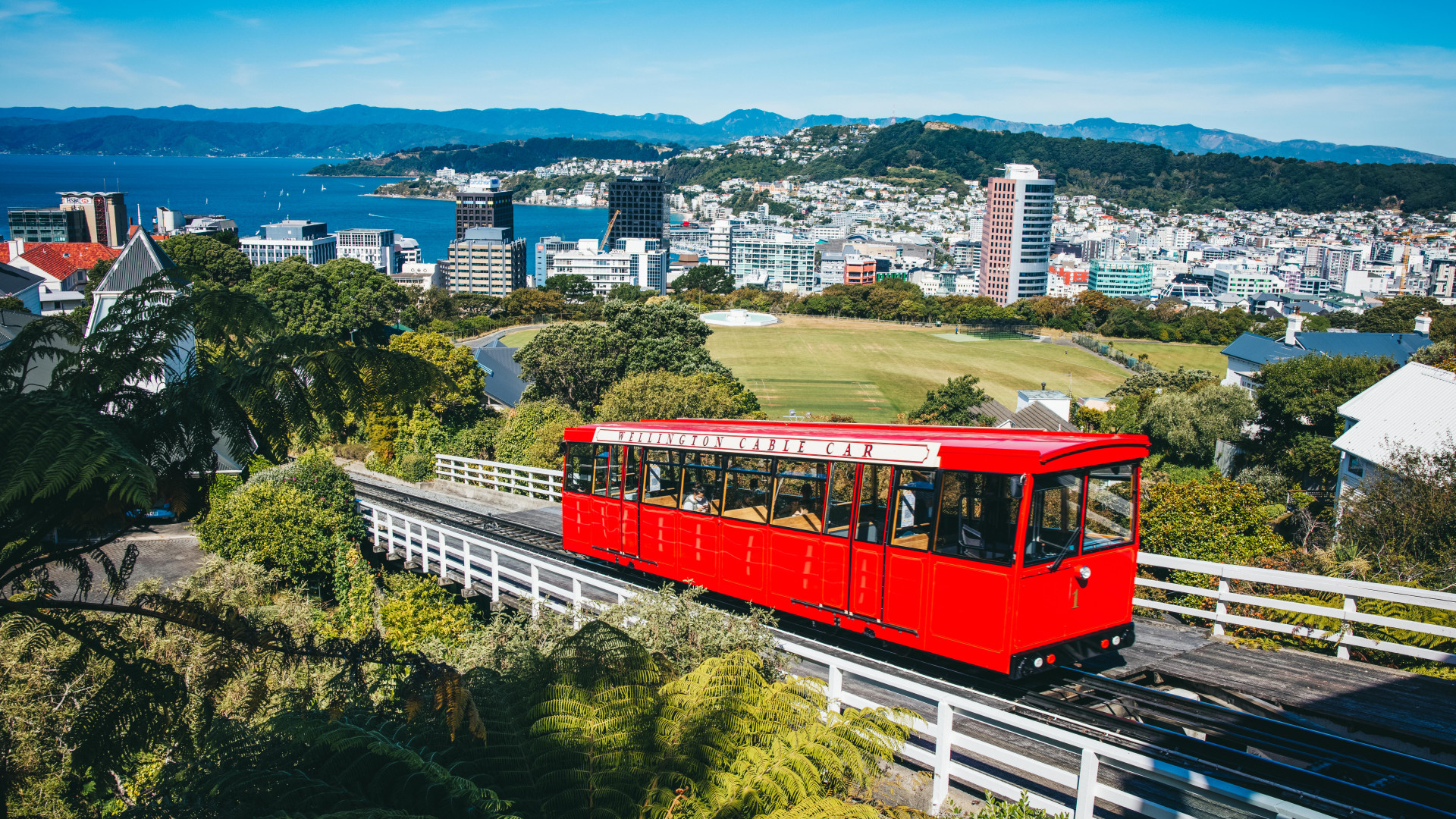 A photo of the Wellington Cable Car. Wellington City is in the background.
